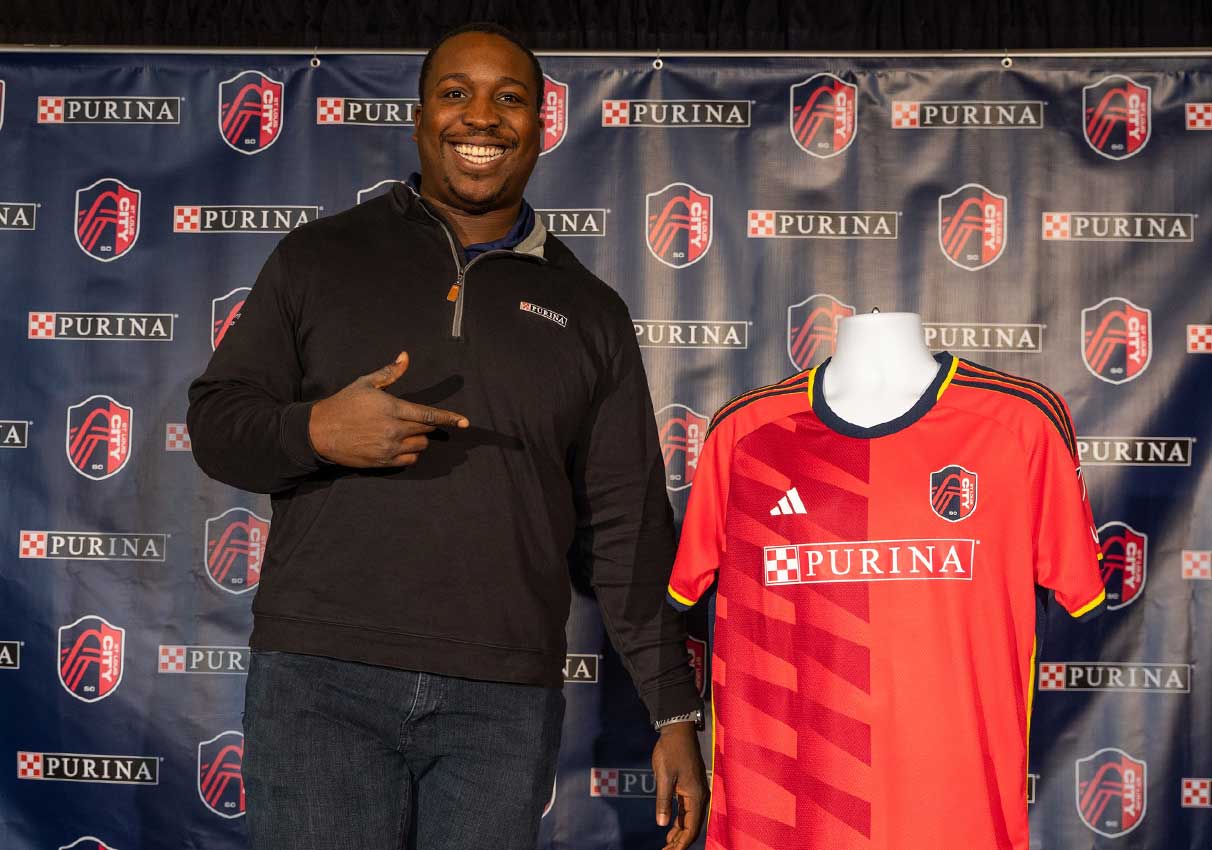 Purina employee showing off St. Louis City SC jersey
